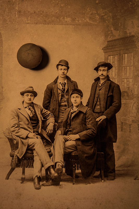 Four Young Men and Their Hovering Orb